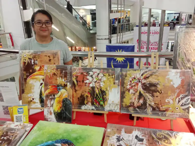 Local artist with her paintings