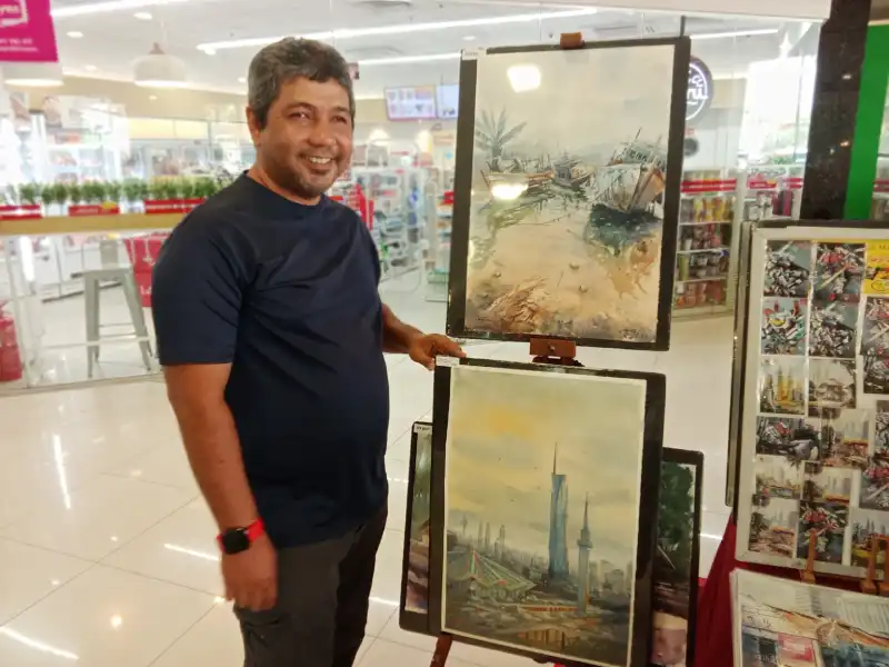 Local artist with his paintings